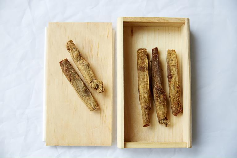 a wooden box of Korean red ginseng root