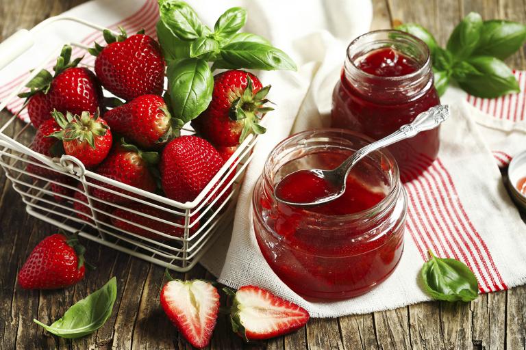 Fresh strawberries and basil leaves